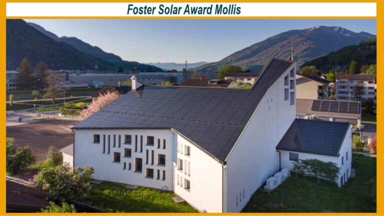 Luftbild der energetisch sanierten Marienkirche in Mollis mit innovativem Solardach.