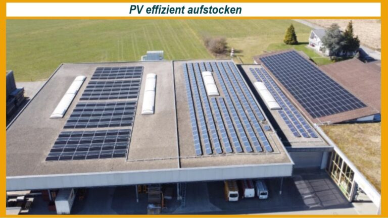 Photovoltaik-Anlage auf einem Industriedach mit zusätzlicher Aufstockung und moderner Energiespeichertechnik.