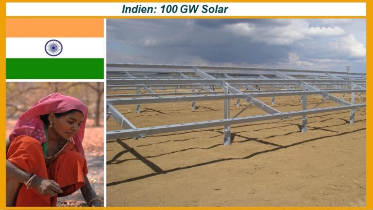 Indische Flagge, Frau in traditioneller Kleidung und im Bau befindliche Photovoltaikanlage – Symbol der Energiewende