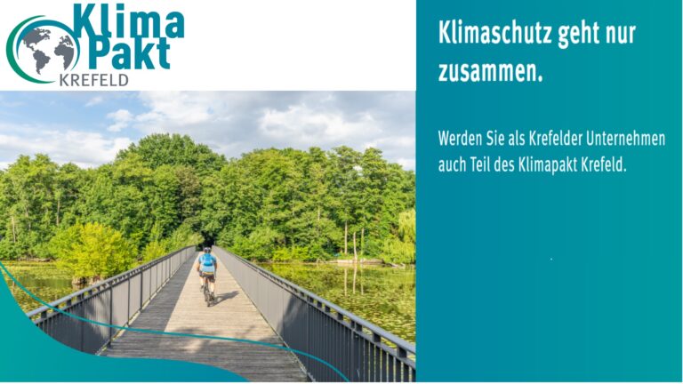 Fahrrad auf Brücke mit Logo des Krefelder Klimapakts – Symbolbild für die Energiewende