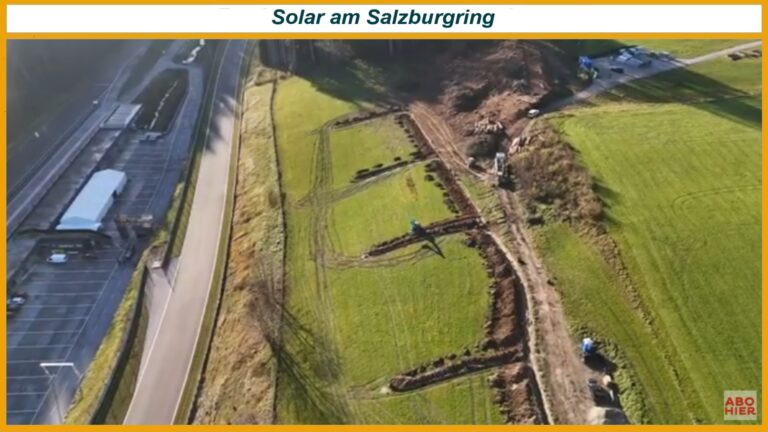 Luftaufnahme von Grünflächen neben einer Straße mit Baggern und frisch gegrabenen Gräben; oben der Schriftzug Solar am Salzburgring.