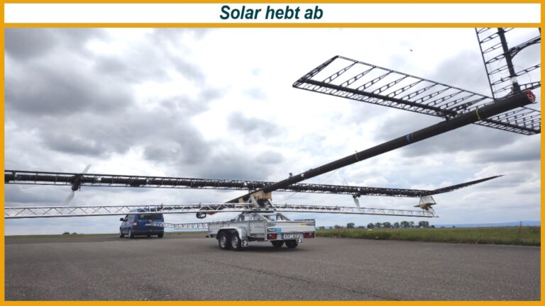 Solarflugzeug mit extrem langen Gitterflügeln auf Anhängern am Boden; oben die Überschrift Solar hebt ab